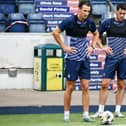 Falkirk's Liam Henderson is pictured with new signing Brian Graham
