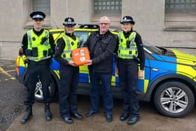 Martin Stuart, from Friends of Forth Valley, hands the life saving devices to Falkirk Area Commander, Chief Inspector Lynsey Kidd
(Picture: Submitted)
