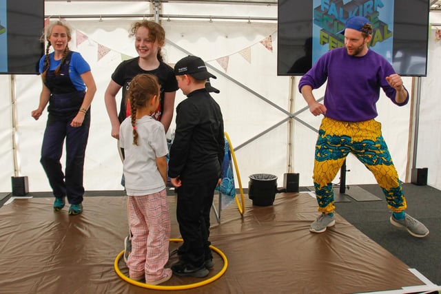 Some young audience members help Barbara and Steve with their Eureka show.