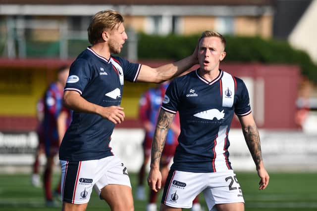 Miller is congratulated by Sean Mackie after goal (Pic by Michael Gillen)