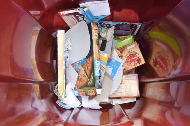 Cardboard put in burgundy bins should be clean or householders risk an amber or worse, a red tag. Pic: Falkirk Council