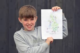 Kieran Watson with his drawing that has gone viral.