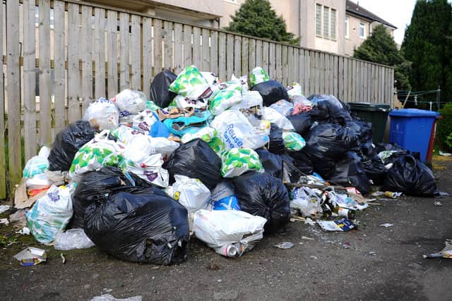 Rubbish piled up in Waggon Road, lane parallel to Bainsford Main Street (Pic:  Picture Michael Gillen)
