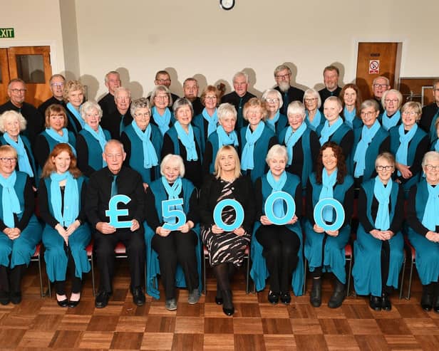 Strathcarron Singers presented a cheque to hospice CEO Mags McCarthy, centre, last month. Pic: Michael Gillen