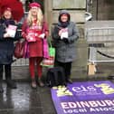 EIS members made their feelings clear about the proposed cuts as they protested outside City Chambers, ahead of the meeting to discuss potential cuts to the education budget.