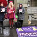 EIS members made their feelings clear about the proposed cuts as they protested outside City Chambers, ahead of the meeting to discuss potential cuts to the education budget.