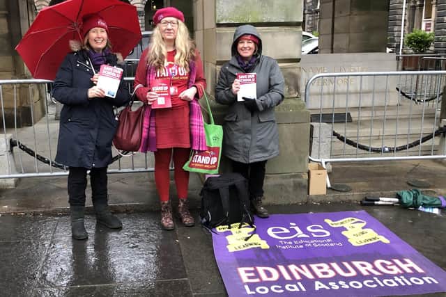 EIS members made their feelings clear about the proposed cuts as they protested outside City Chambers, ahead of the meeting to discuss potential cuts to the education budget.