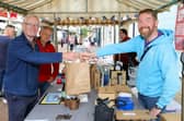 Another satisfied customer - Jim Bird buying goods from Pete Rossborough.