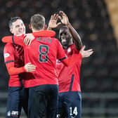 Blair Alston is mobbed by team-mates after scoring his spectacular free-kick at Dumbarton (Pic by Ian Sneddon)