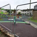 Safety fencing around the new park has been pushed apart to allow children through. Pic: Michael Gillen
