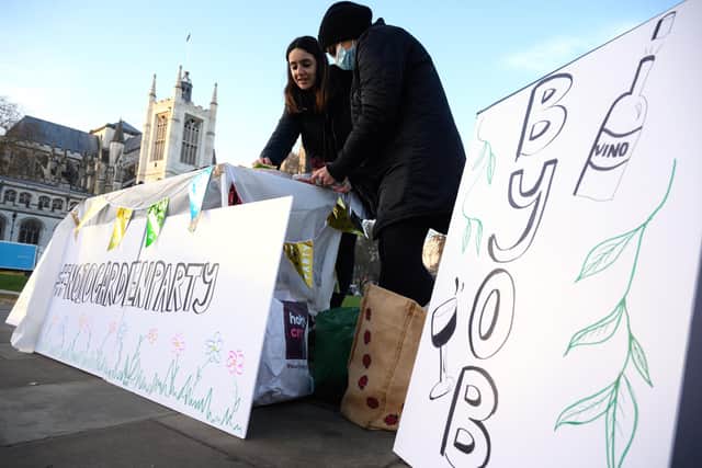 Protestors set up a mock rule-breaking garden party in Parliament Square ahead of Boris Johnson speaking at Prime Minister's Questions. Picture: Leon Neal/Getty Images