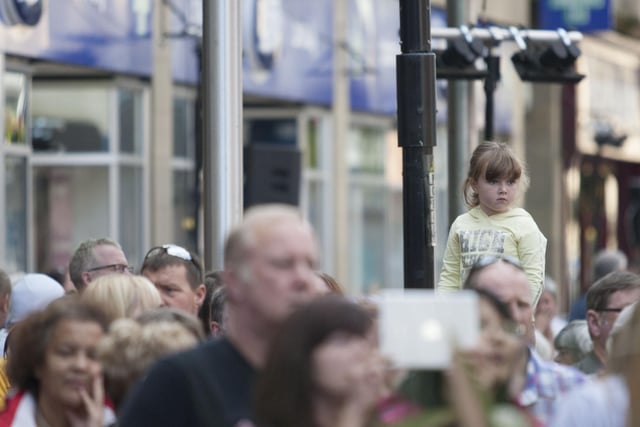 Crowds looking on.
