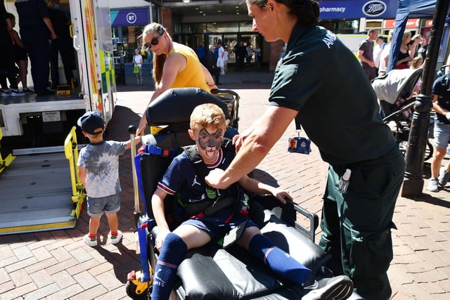 Matthew Jervis, six, with paramedic Sarah McFadyen at Emergency Services Day