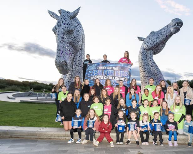 Youngsters from Sapphire Cheer walked from their studio to the Kelpies as a sponsored walk on Tuesday night as part of their fundraising efforts.  (Pic: Michael Gillen)