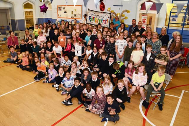 The entire school turned out for the retiral presentation to Annemarie O'Neil who left Carmuirs Primary after over three decades. Pic: Michael Gillen