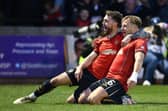 Brad Spencer celebrates with goalscorer Sean Mackie (Photo: Michael Gillen)
