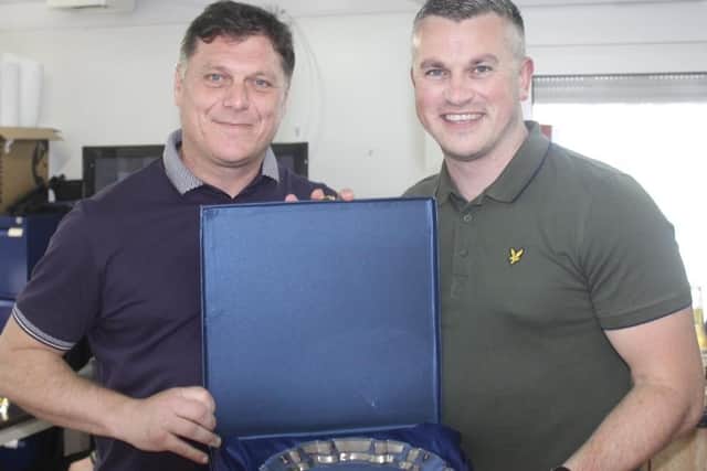 Dunipace captain Danny Ashe, right, is presented with a salver to mark his testimonial by manager Danny Smith. Pic: Contributed