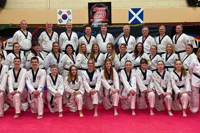 The 36 black belts picture with their coaches (Photo: Contributed)