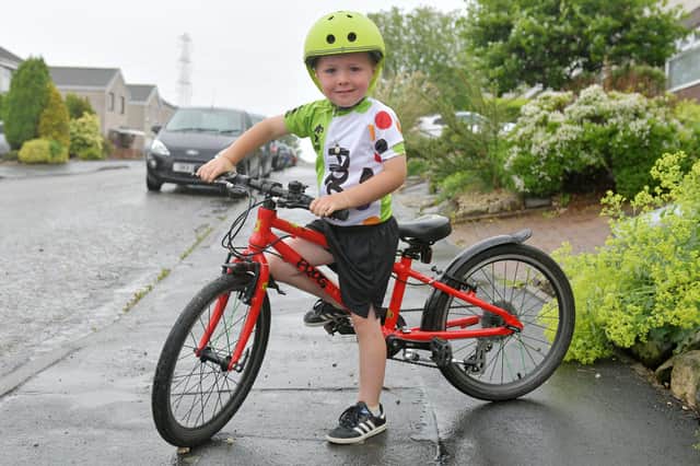 Ché Hanlon (4) who aims to cycle 200 miles in July to raise money for local food banks.