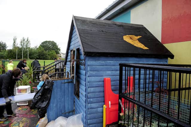 Parents and staff clear up after vandalism to nursery outdoor area at Carron Primary School in 2017