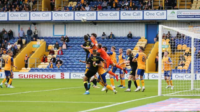 Mansfield Town goalkeeper Nathan Bishop punches the ball clear - Pic Chris Holloway