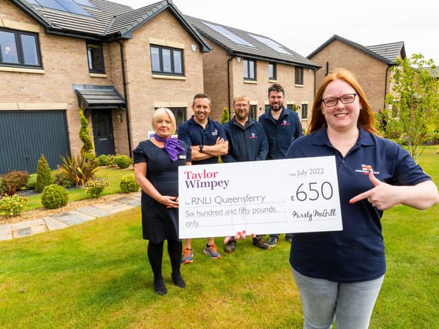 RNLI representatives were on hand to receive a cheque from TW Sales Executive Helen Allenby. Pictured from the RNLI are - Stuart Ebdy (dark hair, beard), Adele Allan, Chris Brydie (shorts) and Andrew Ventham (glasses, beard).