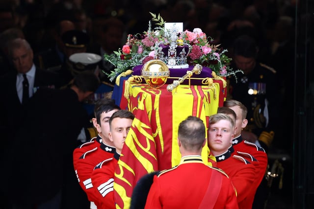 The coffin is carried out following the State Funeral of Queen Elizabeth II, held at Westminster Abbey, London. Picture date: Monday September 19, 2022.