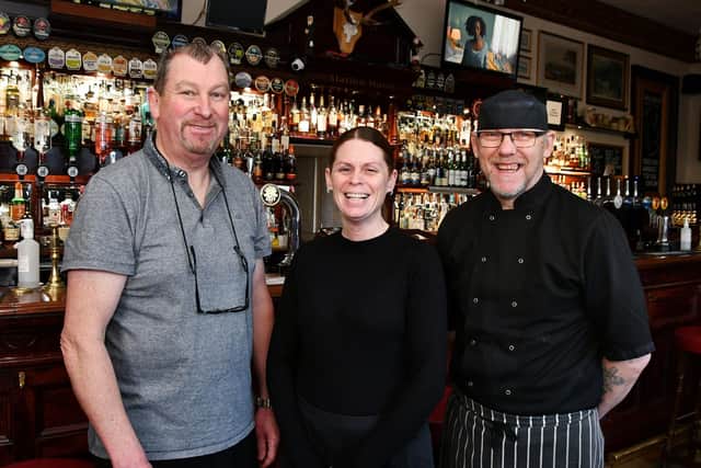 John Black, owner of the Station Hotel with head waitress Kirsty Callaghan head waitress and head chef Tom Long. Pic: Michael Gillen