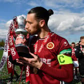 Stenhousemuir captain Gregor Buchanan enjoys the moment as the Warriors' team are presented with the League Two trophy (Photo: Michael Gillen)