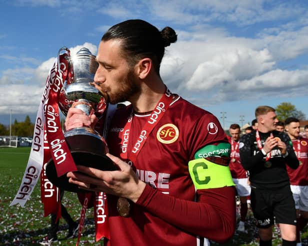 Stenhousemuir captain Gregor Buchanan enjoys the moment as the Warriors' team are presented with the League Two trophy (Photo: Michael Gillen)