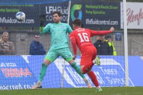 Ross County loanee Matthew Wright heads home his first Falkirk goal against Peterhead (Pictures by Ian Sneddon)