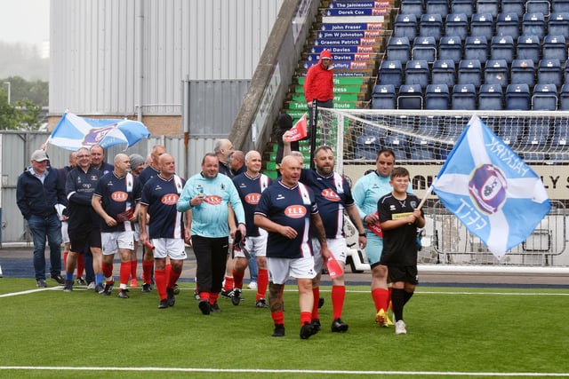 Falkirk FFIT T8s enter the pitch for the opening ceremony
