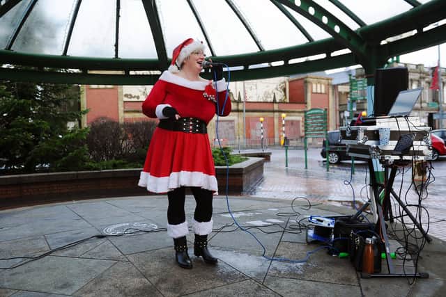 Debbie Muirhead marks the re-opening of The Dundas with a festive performance on Grangemouth bandstand