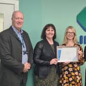 Link's Grant Alexander, Sarah Smith and Nicky Paton receive the certificate from the DWP's Gill Jardine