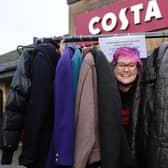 Debbie Beveridge with some of the donated coats.