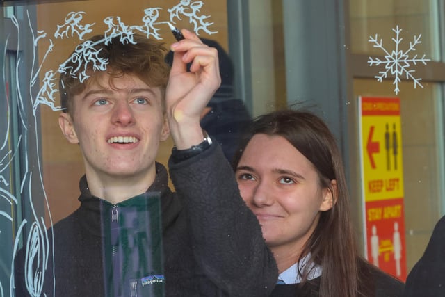 Pupils spent time decorating windows with festive designs recently.