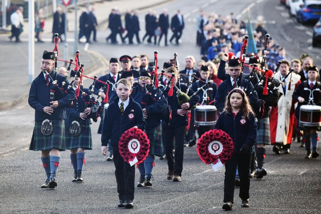 Camelon Pipe Band leads the Remembrance Sunday parade from the town hall
