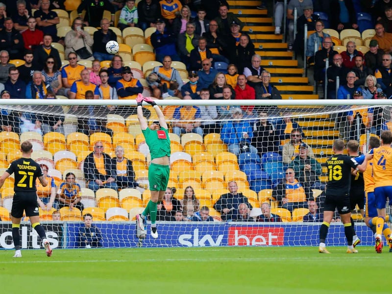 Harrogate Town Goalkeeper Mark Oxley makes the save.
