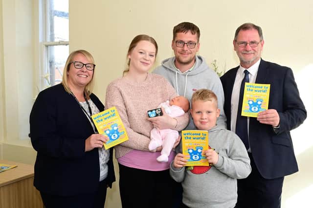 Chief Registrar Fiona Mitchell with baby Avah and her family from Denny, mum Lindsay McDonald, dad Kevin Reddy with Avah's brother Aidan, and Councillor Gary Bouse. Pic: Falkirk Council