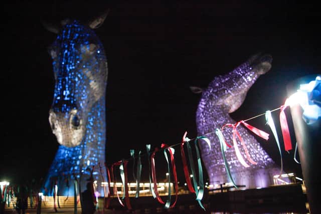 Ribbons with messages and candles light up the Kelpies for Baby Loss Awareness Day in 2021. Pic: Scott Louden.