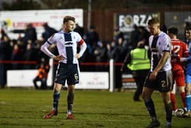 Dejected: Coll Donaldson looks on as Bonnyrigg Rose celebrate their 2-1 Scottish Cup fourth round win over the Bairns - with that result ending Falkirk's unbeaten run (Photo: Michael Gillen)