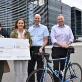 Pictured with the cheque for £1000 are Claire Kennedy (Strathcarron Hospice) and Claire Black, Ronnie Robinson and Tim Beesley (INEOS)