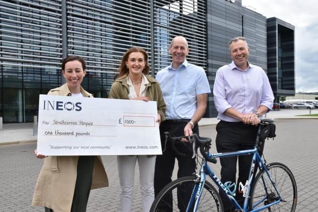 Pictured with the cheque for £1000 are Claire Kennedy (Strathcarron Hospice) and Claire Black, Ronnie Robinson and Tim Beesley (INEOS)