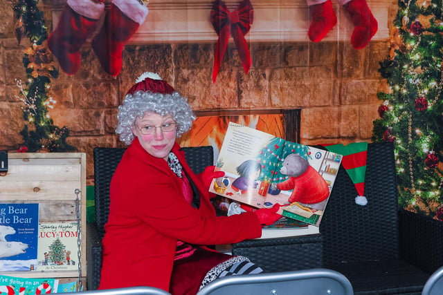 Mrs Claus reads a story to the youngsters