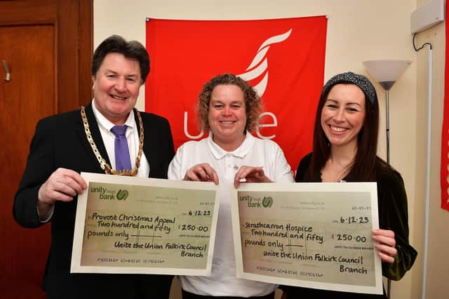 Helen Welsh, Unite the union Falkirk Council branch convenor (centre), hands over £250 to both Provost Robert Bissett for the Provost's Christmas Appeal and Claire Kennedy, corporate fundraiser for Strathcarron Hospice.   (Pic: Michael Gillen)