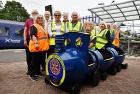Members of Rotary Club of Falkirk putting new planters in place at Grahamston Railway Station received from Denny and Bonnybridge Men's Shed. President Linda Noble, front yellow and dark glasses.  Picture Michael Gillen