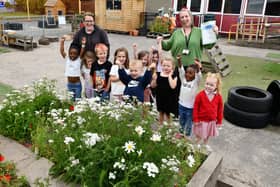 Youngsters from Sacred Heart ELC won the heritage theme award in the Keep Scotland Beautiful pocket garden competition.  (Pic: Michael Gillen)
