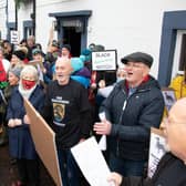 Protestors outside the Black Bitch tavern at a previous protest against Greene King's plans to change the pub's name.