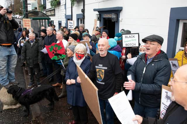 Protestors outside the Black Bitch tavern at a previous protest against Greene King's plans to change the pub's name.