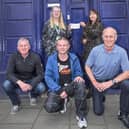 Hugh’s wife, Mags Wright (top right), handed over the cheque at the Cancer Research UK shop in High Street, Linlithgow. Left to right Yvonne Stevenson, Mags Wright, Ian Shiells, David Thornton, Colin Fowler.